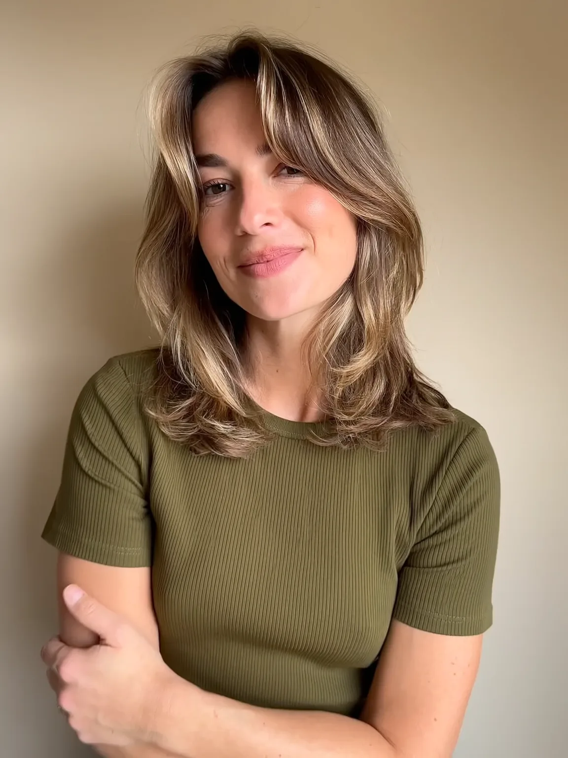 Soft Medium Layers with Sun-Kissed Caramel Highlights and Curtain Bangs